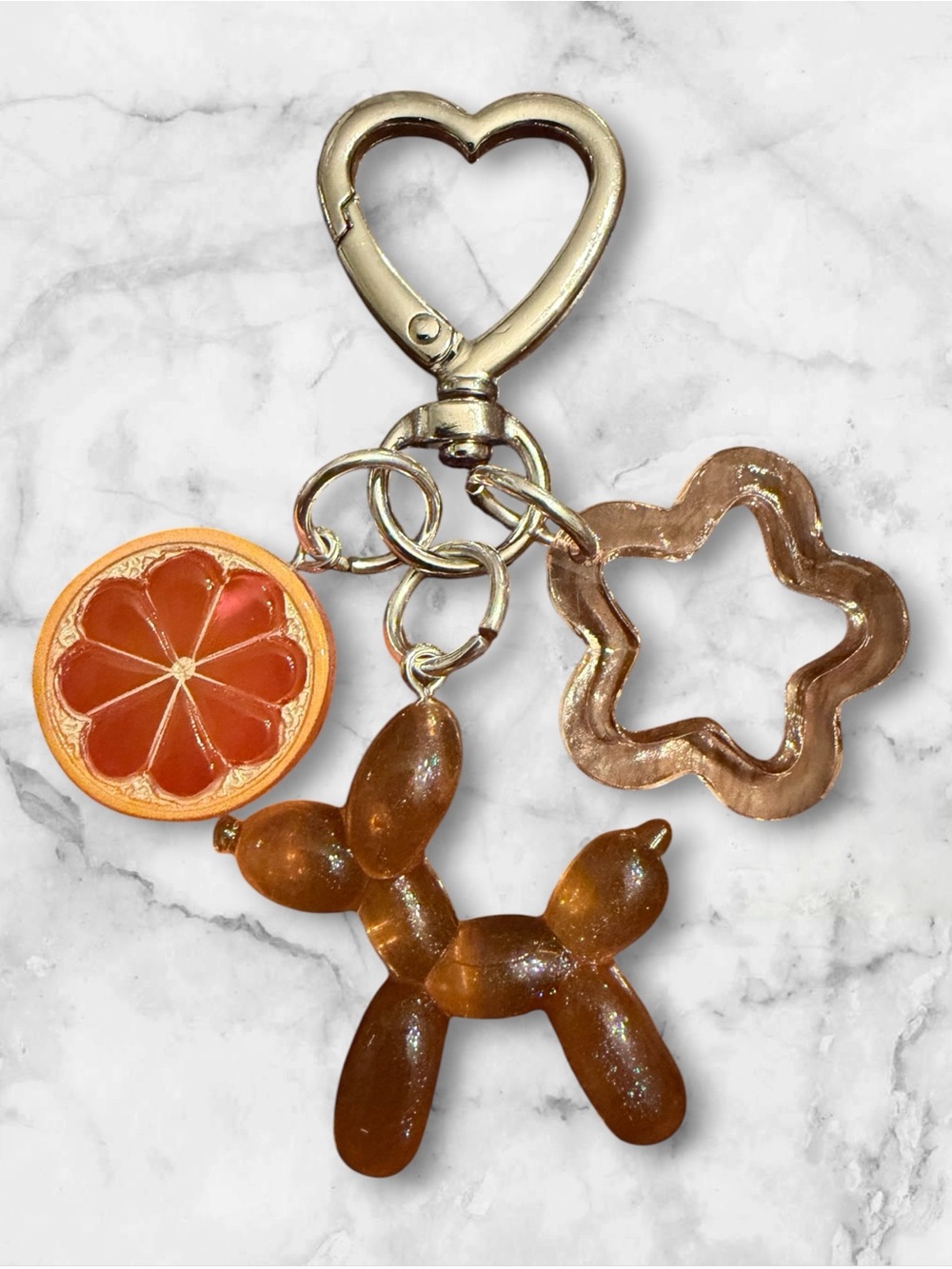 Glittery Amber Balloon Dog Keychain with Orange Slice & Flower Charm
